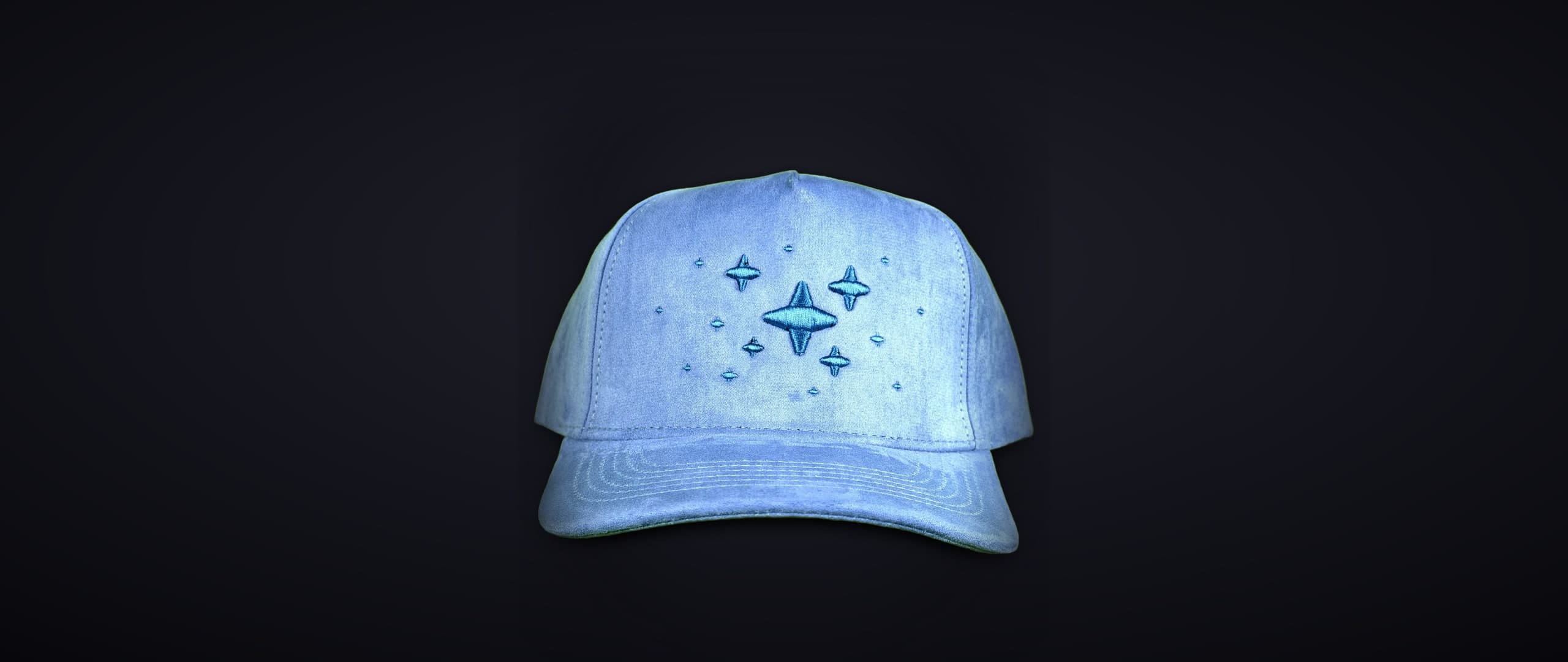 Sparkle Cap -- sky-blue suede 5-panel with blue 3D puff star embroidery on the graphite studio sweep